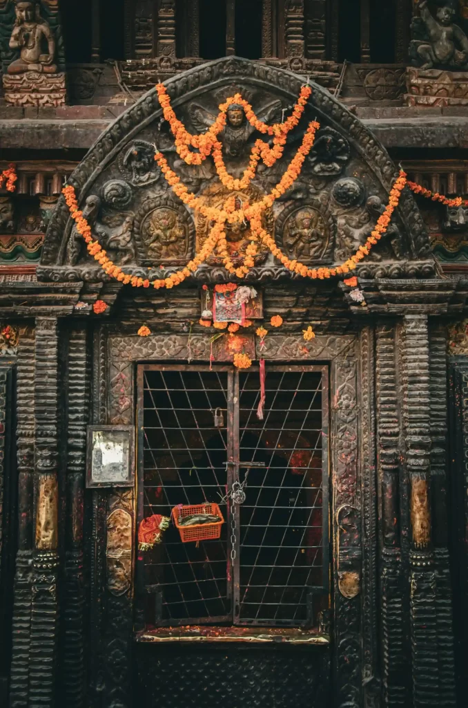 Wooden intricate design door of a temple in Kathmandu