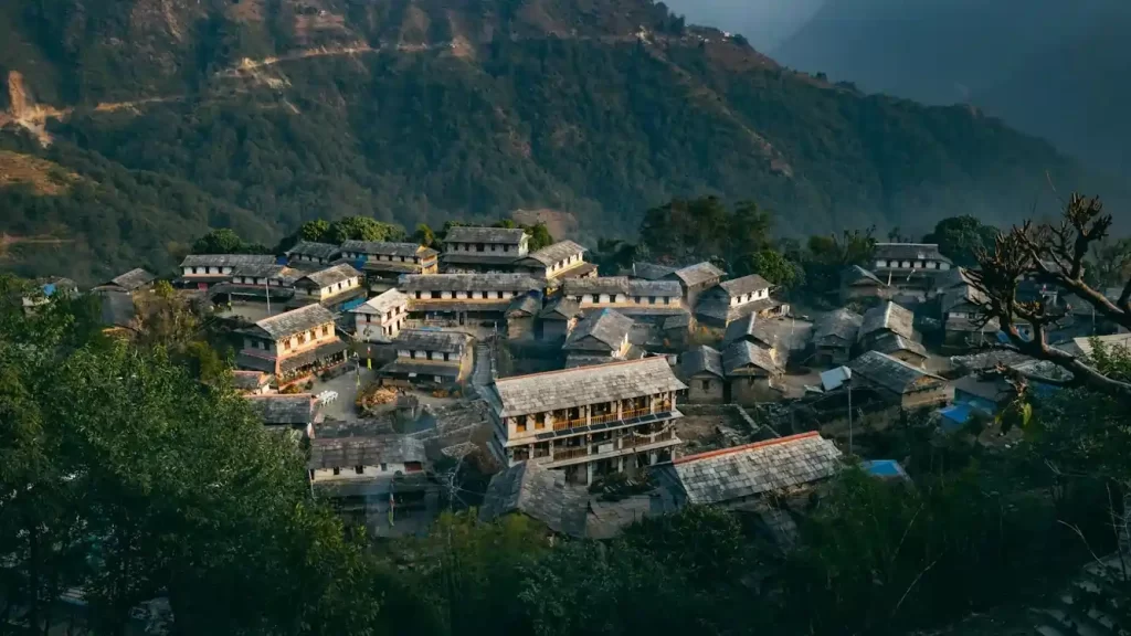 Traditional Nepali village houses with stone laid roofs in rural Nepal