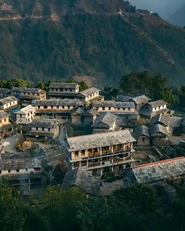 Traditional Nepali village houses with stone laid roofs in rural Nepal