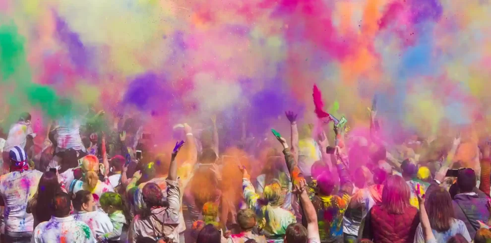 a group of people celebrating holi