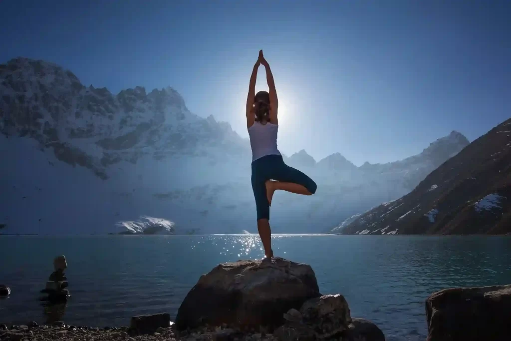 an women doing yoga poses in Himalayan region of Nepal