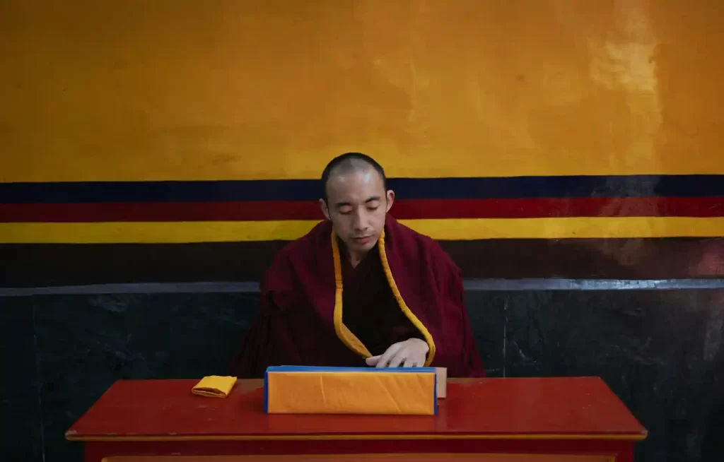 monk reading his script