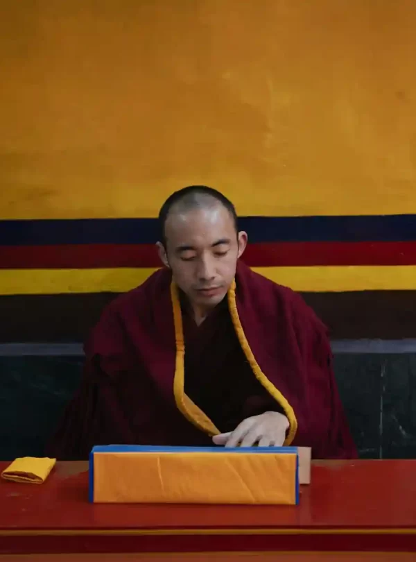 monk reading his script