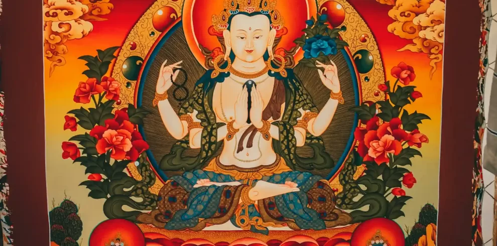 Intricate Thangka painting with detailed Buddhist motifs and sacred symbols