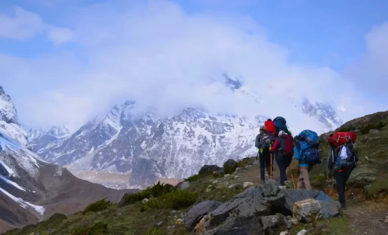 four trekkers ascending Manaslu Trail