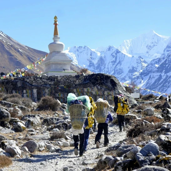 porters carrying bag in langtang trail